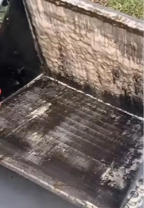 Outdoor AC condenser coil heavily caked with dust and dirt before professional cleaning in Bahrain
